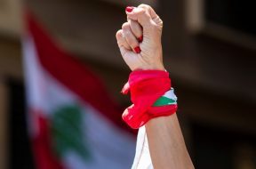 An-anti-government-protester-during-ongoing-protests-in-front-of-the-Ministry-of-Economy-in-downtown-Beirut-Lebanon-May-18-2020.-AP-Photo-Hassan-Ammar-1280×640