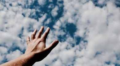 hands-fingers-arm-cloudy-blue-sky