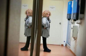 ghada-aoun-standing-talking-on-the-phone