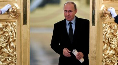 Russian President Vladimir Putin enters a hall to meet with members of the Presidential Council for Civil Society and Human Rights at the Kremlin in Moscow