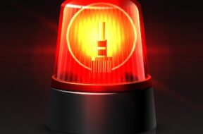 vector-red-police-car-top-light-glowing-dark-black_134830-785