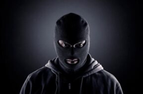criminal-wearing-black-balaclava-hoodie-600nw-1874960659