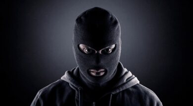 criminal-wearing-black-balaclava-hoodie-600nw-1874960659