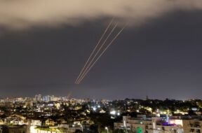 An anti-missile system operates after Iran launched drones and missiles towards Israel, as seen from Ashkelon